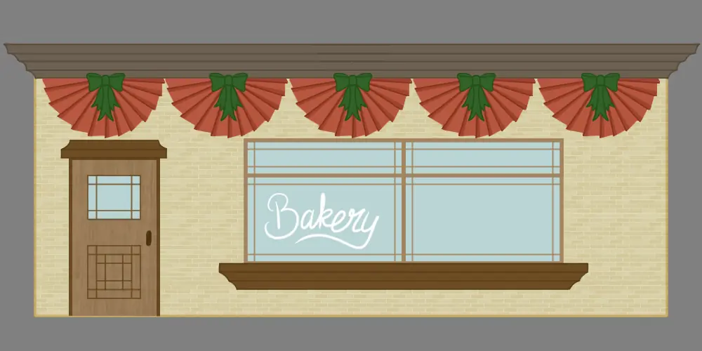 Bakery storefront with red festival bunting, a wooden door and a large window
